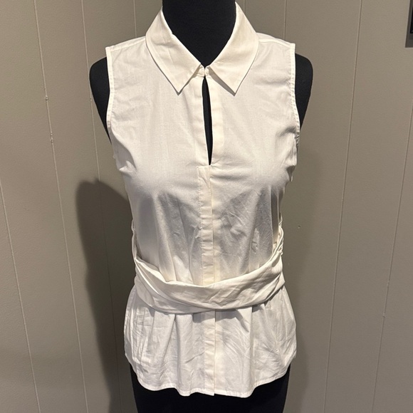 Ecru white sleeveless hidden button slit neckline cummerbund style blouse. XS - Picture 1 of 9